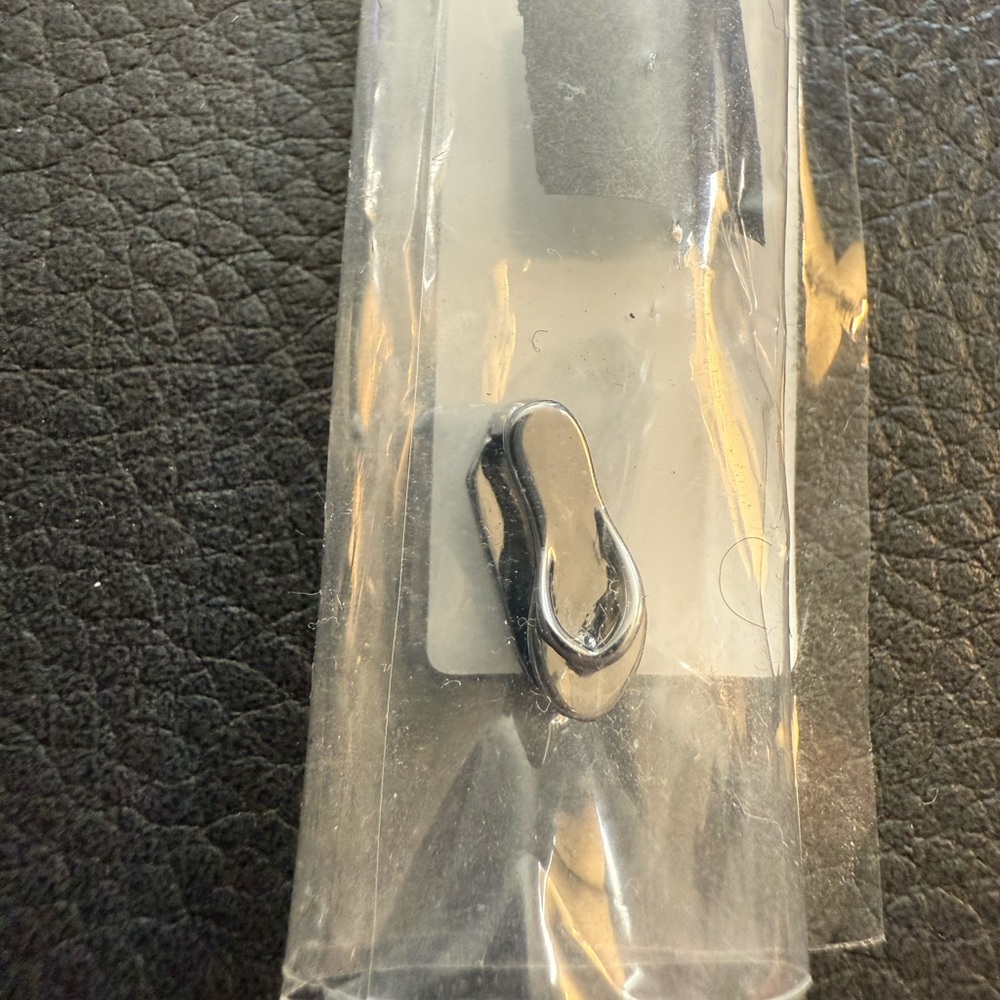 KEEP Collective silver flip flop charm.